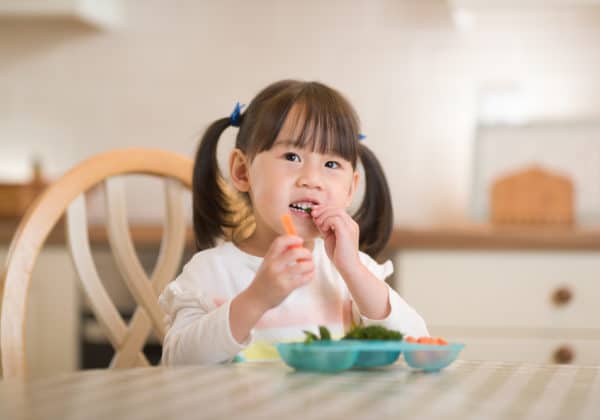 4 Steps to Get Your Wiggly Kid to Sit Still at Meals