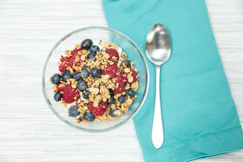 Greek yogurt parfait topped with berries and granola