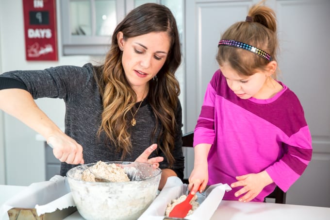 mom and daughter making homemade bread together