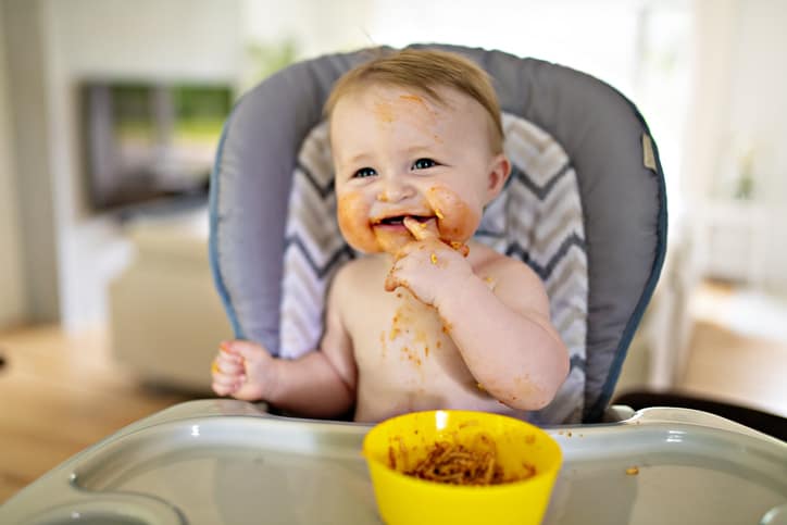 messy baby with food on face