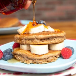 vegan carrot cake pancakes stack with berries and fruit