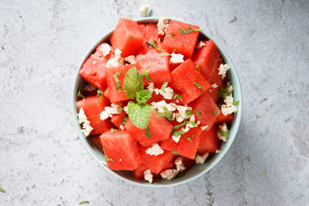 watermelon salad with crumble feta cheese in bowl