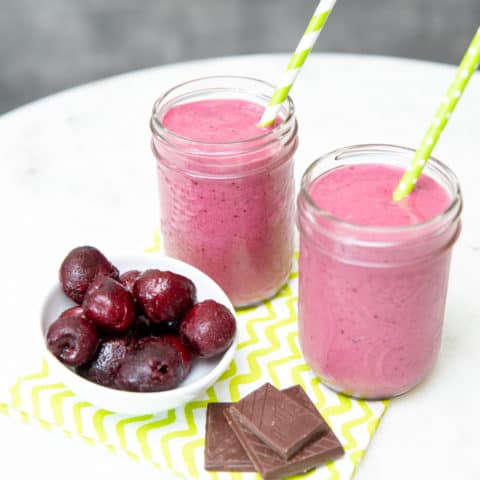 chocolate cherry smoothies in jars with cherries and chocolate