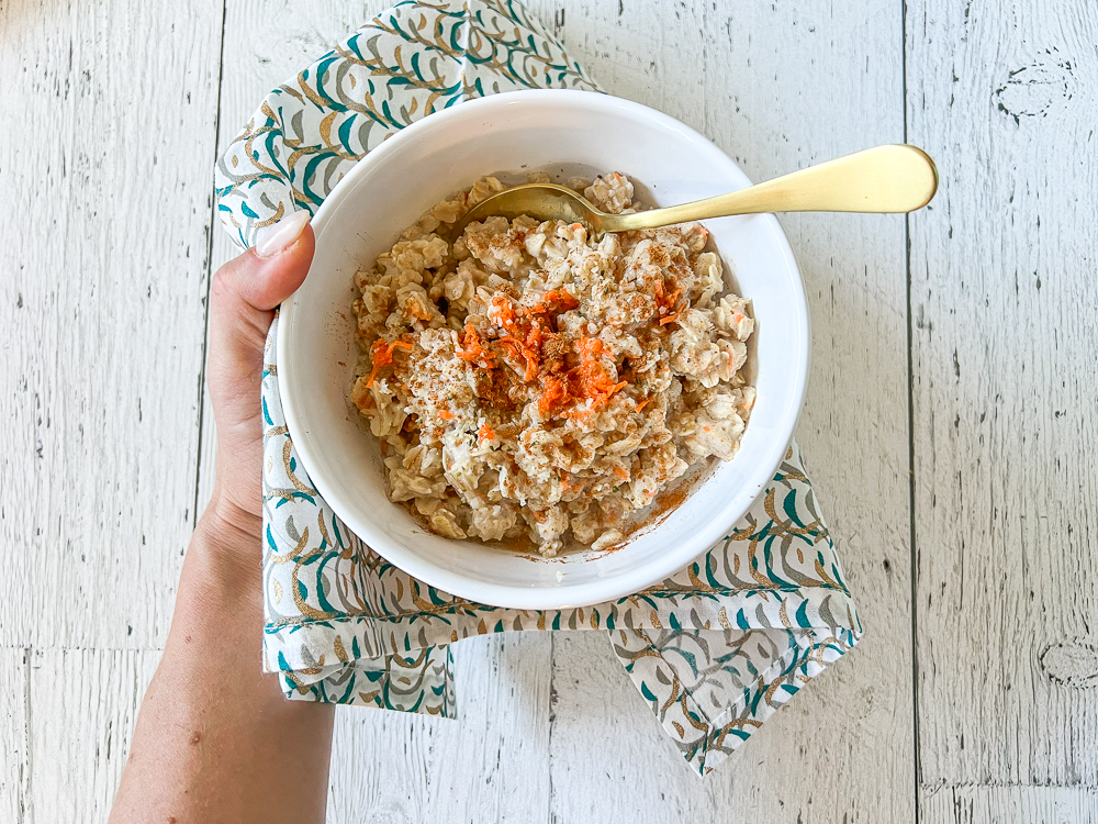 carrot cake oatmeal in a bowl with colourful napkin