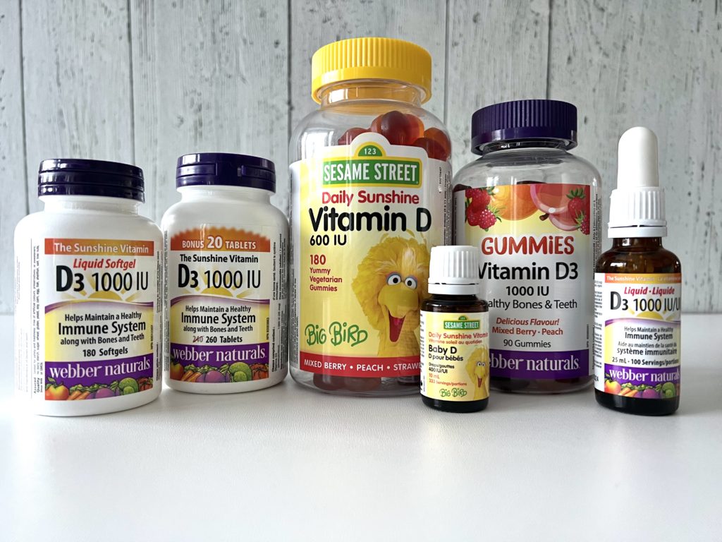 array of vitamin D supplement bottles in a row on a counter