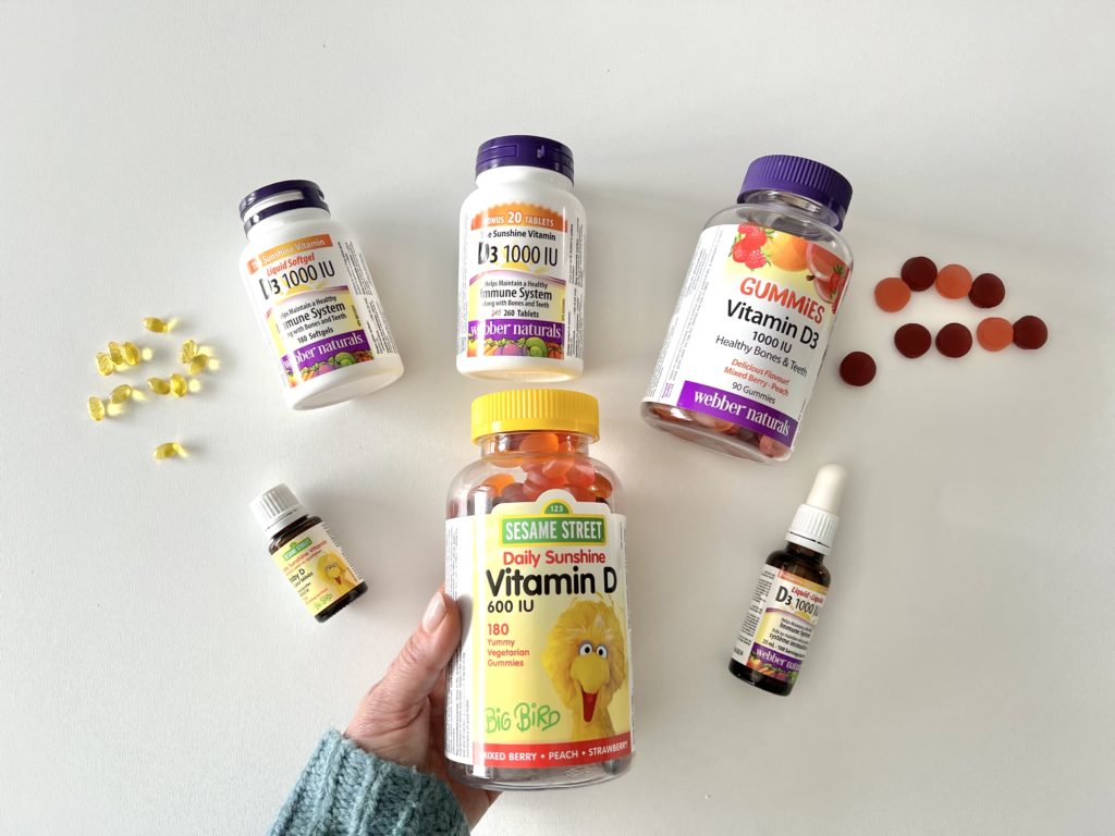 array of vitamin D supplements on a white backdrop