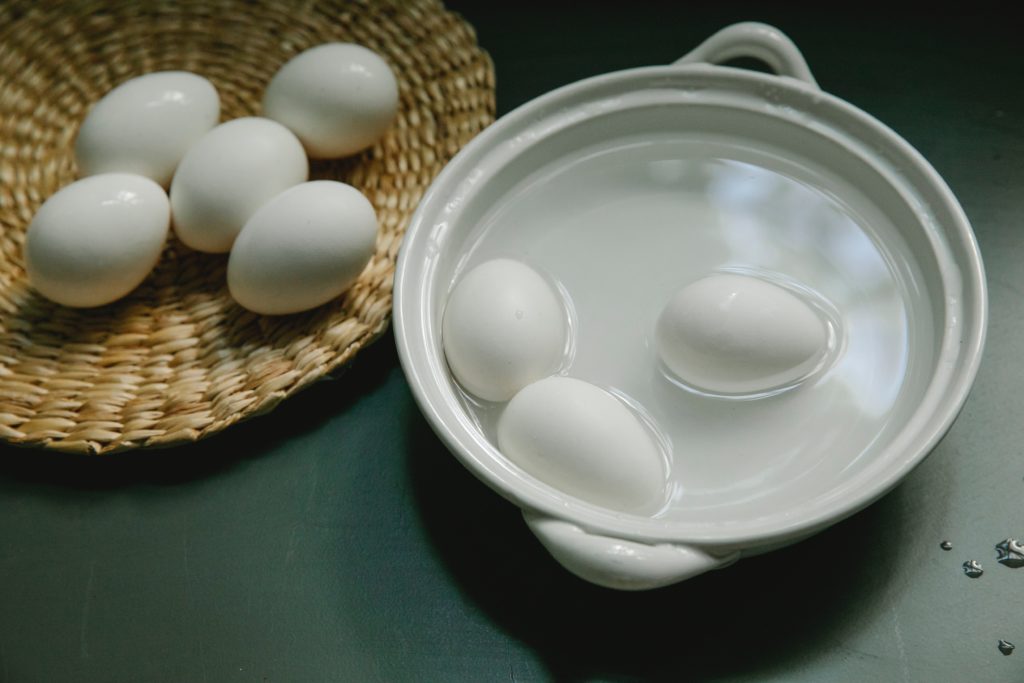 hard cooked eggs in a water bath