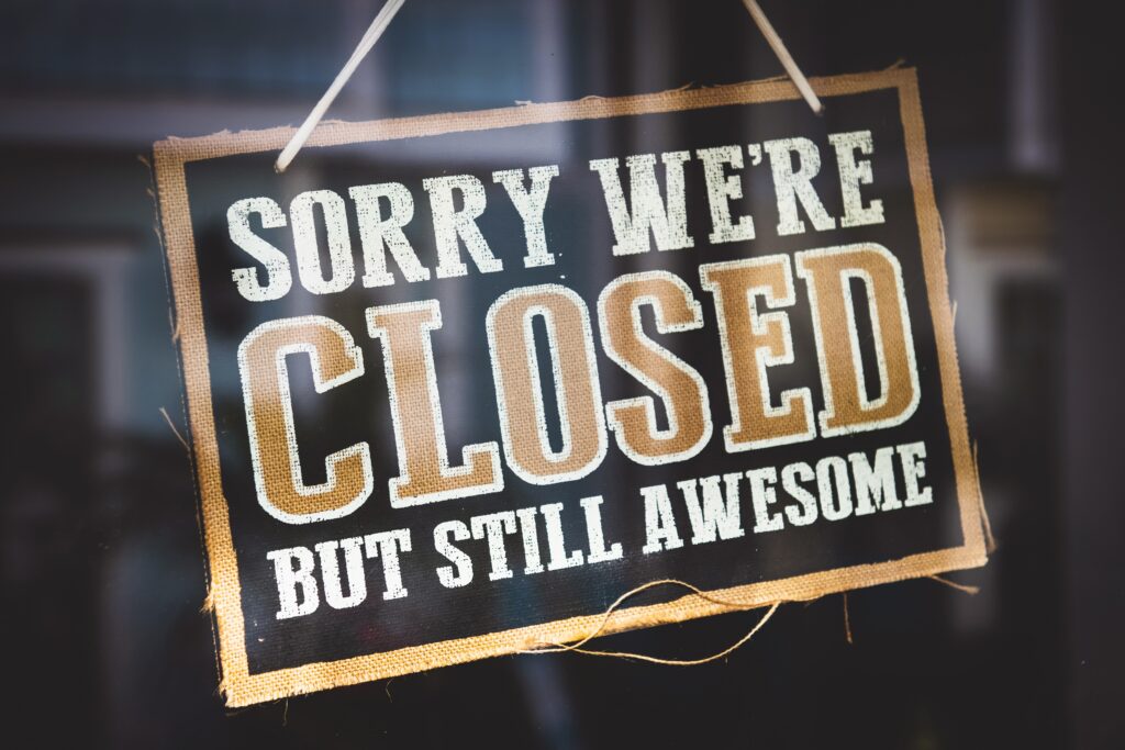 A "sorry we're closed but still awesome" sign on a window