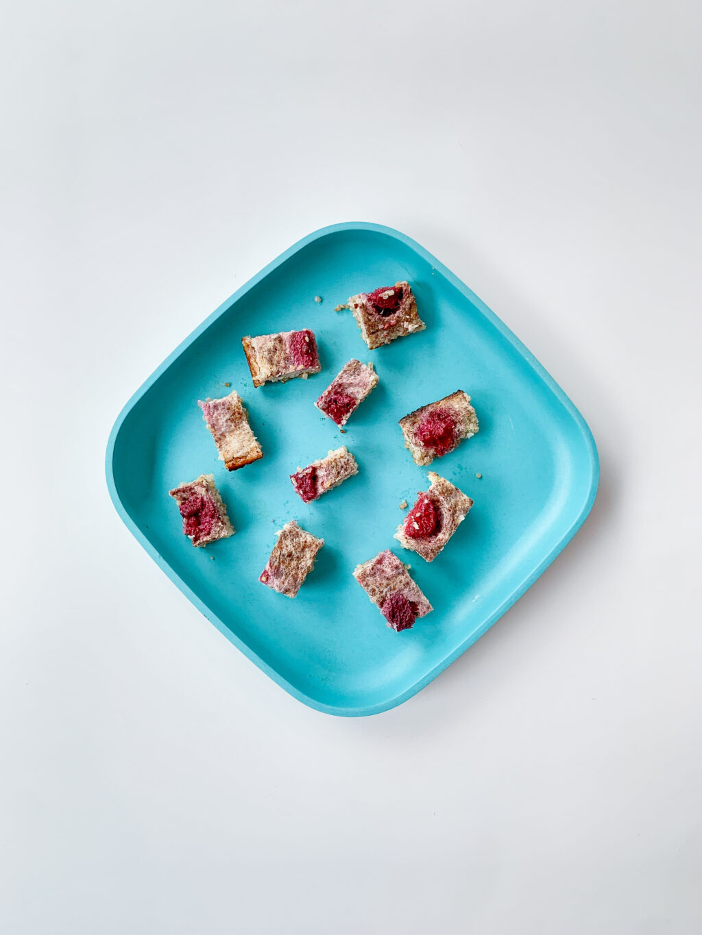 top view of baby-led weaning breakfast bake made with quinoa cut into small cubes