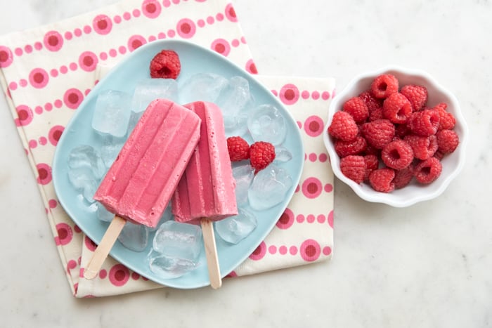 top down view of homemade raspberry popsicles for kids