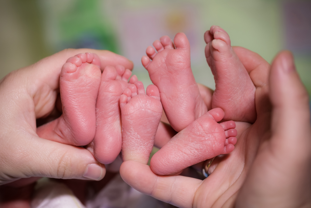 close up of little feet of triplet babies
