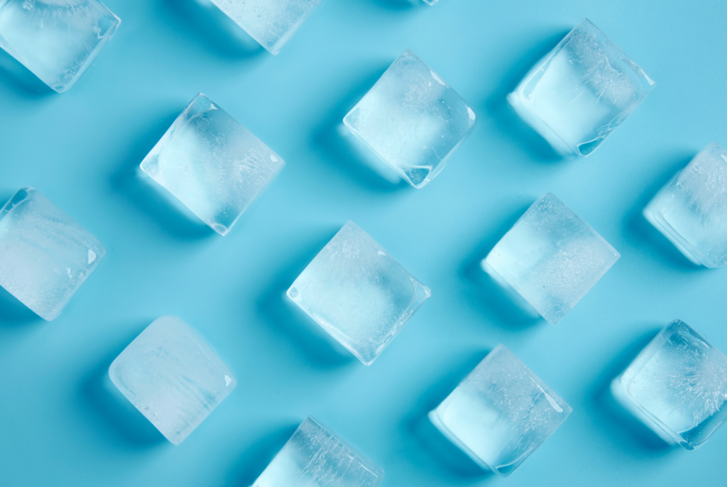 top down view of ice cubes on a blue background