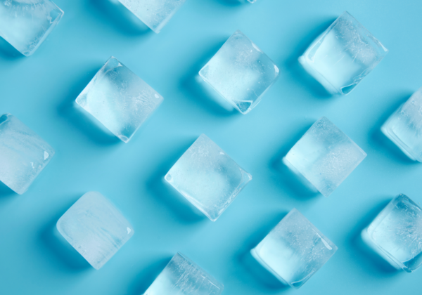 top down view of ice cubes on a blue background