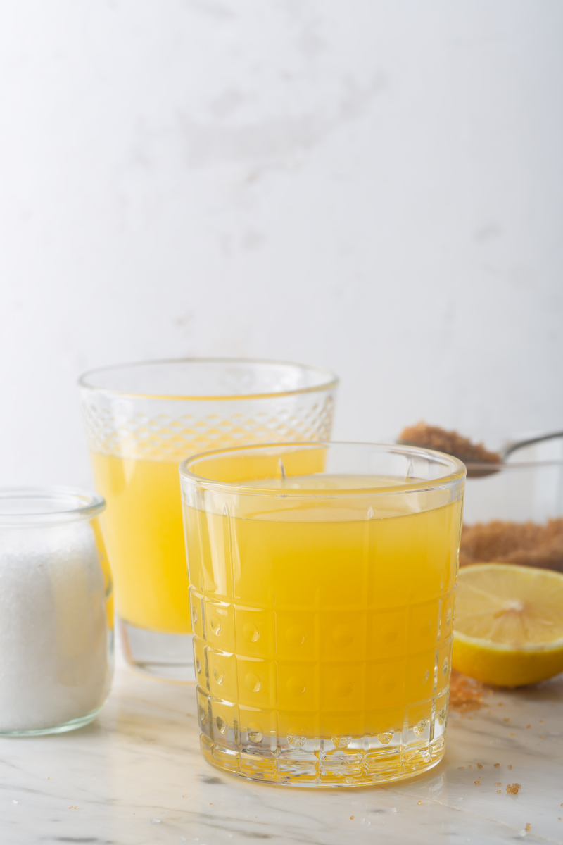 close up of a homemade sports drink using orange juice