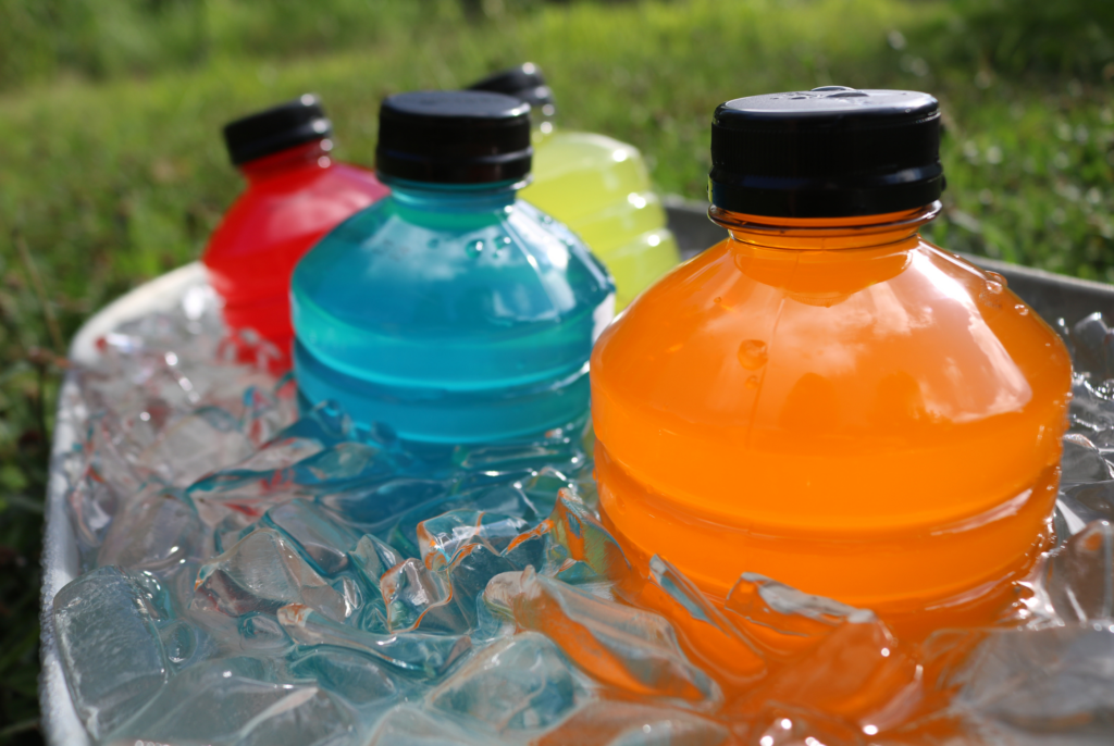 close up of Gatorade sports drinks in a bucket filled with ice