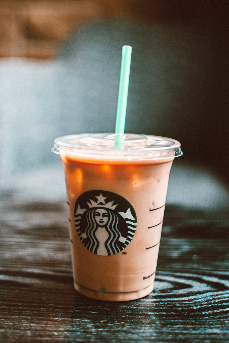 close up of a milk-based Starbucks drink in a clear cup