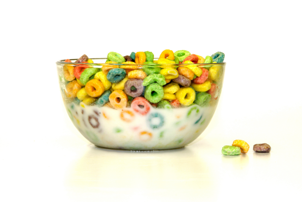 side view of a bowl of sugary cereal with milk