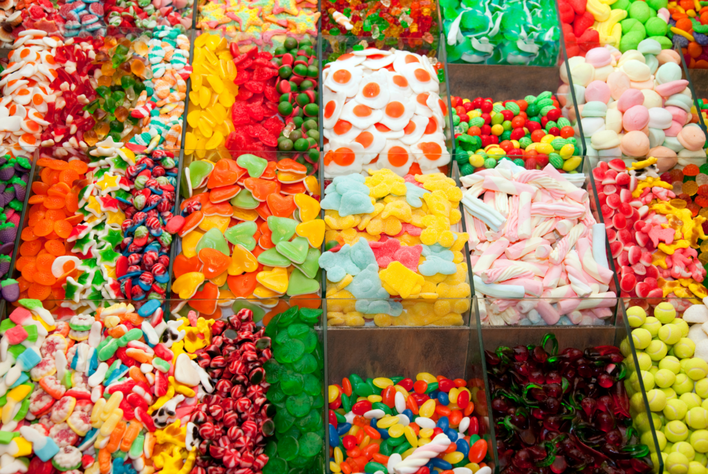 close up of a bunch of colorful candies in bins