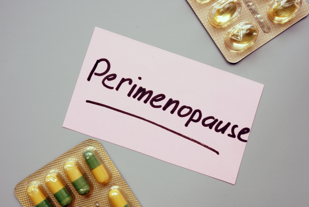 top down view of perimenopause on a sticky note