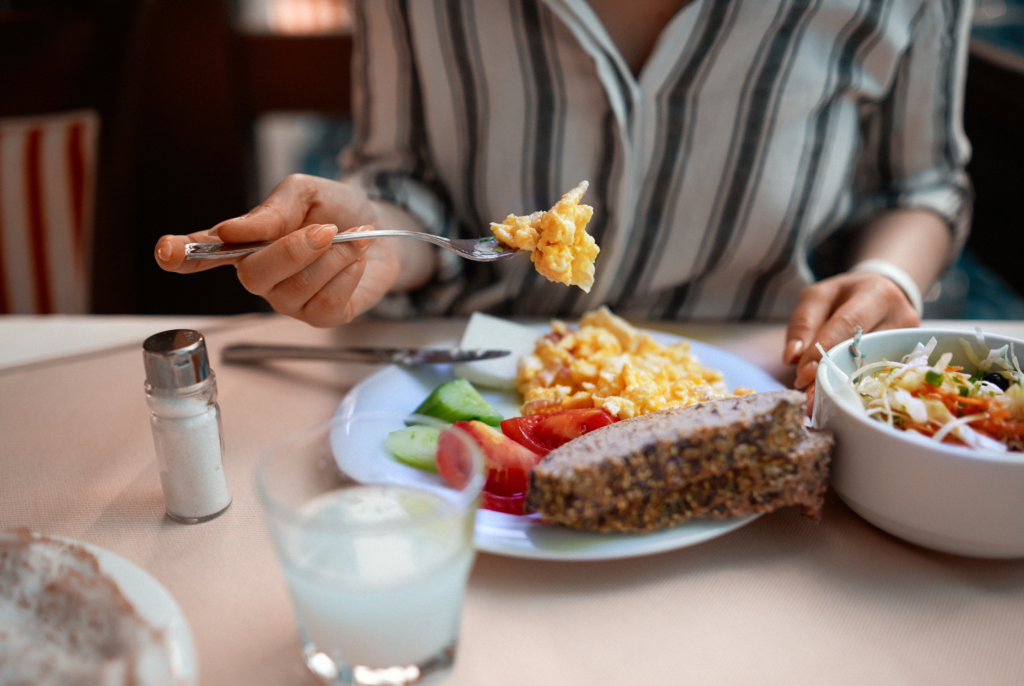 A woman in perimenopause eating protein-rich foods